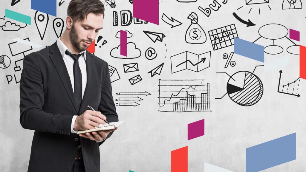 Businessman planning with charts and symbols related to UAE free zone companies.
