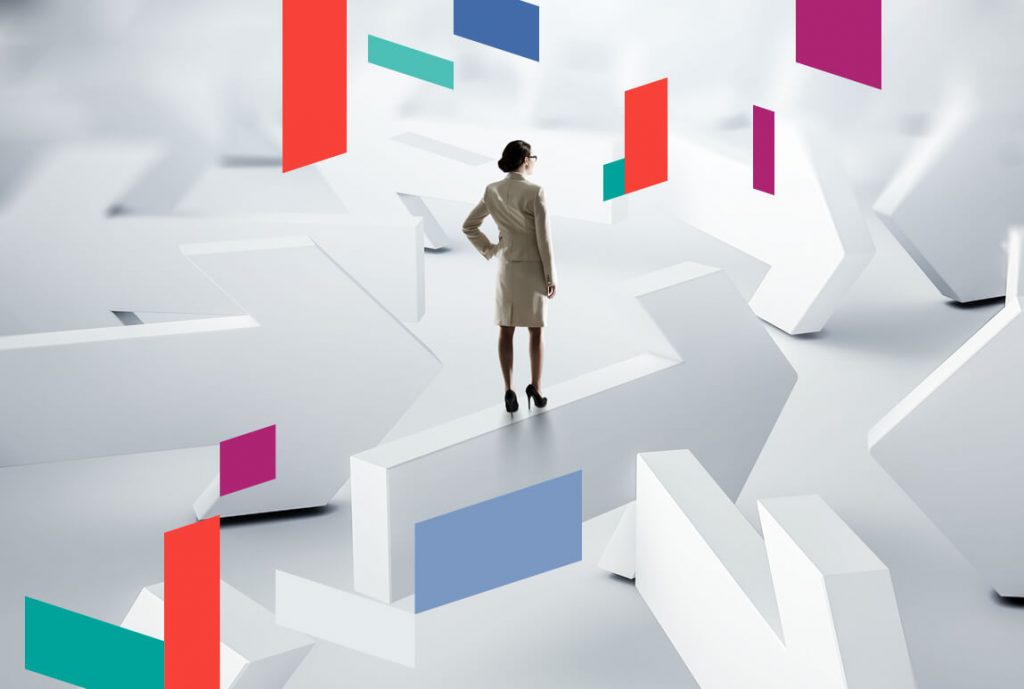 Businesswoman standing amid abstract arrows and colorful rectangles.