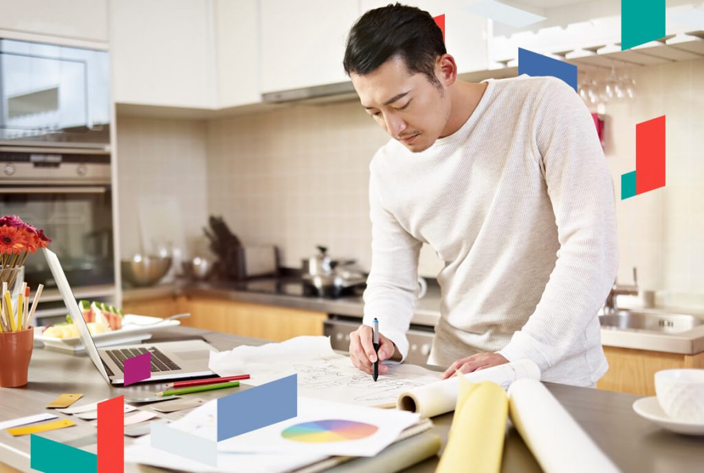 Man reviewing documents in a modern office setting.