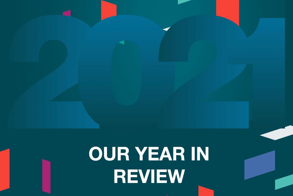 2021 Our Year in Review text with colorful geometric shapes.