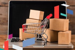 Laptop with cardboard boxes and cart, representing business setup in SPC Free Zone, UAE.