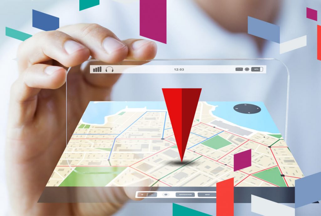 Person holding digital map with location pin symbol.