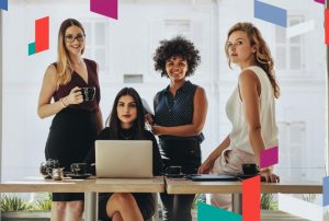 Group of diverse women discussing business setup options in a modern office.