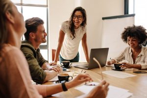 Team of four discussing business setup in a modern office.