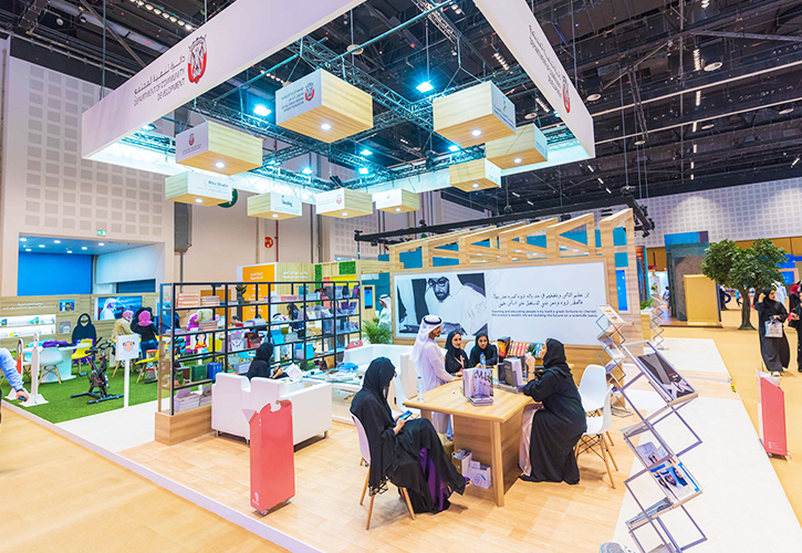 Exhibition booth showcasing business setup in UAE, featuring SPC Free Zone and Sharjah Free Zone.
