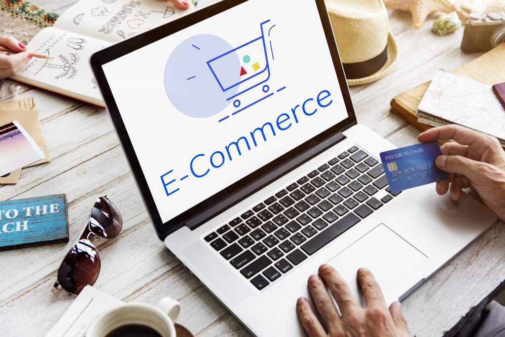 E-commerce setup illustration with a credit card and laptop.
