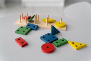 Colorful geometric blocks on a table, representing business setup concepts.
